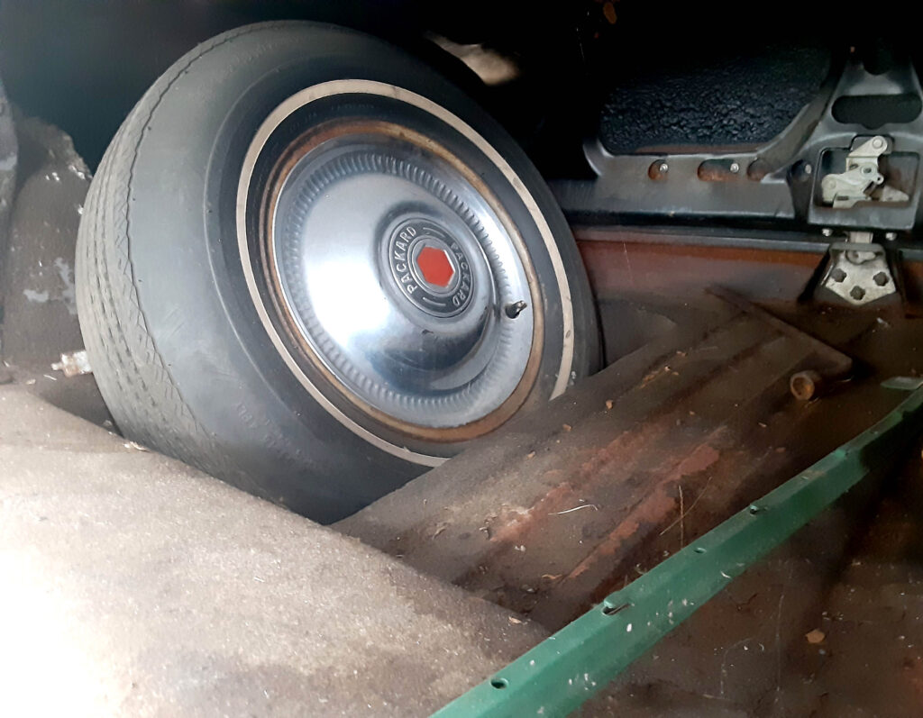 1953 Packard Cavalier spare tire in trunk.
