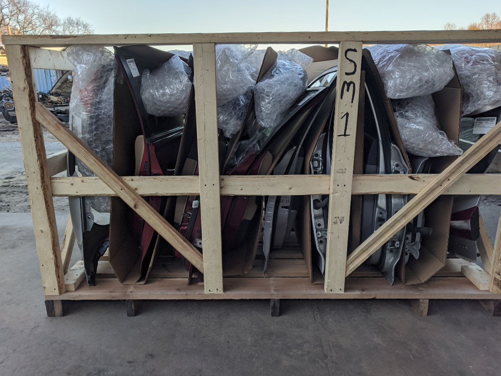 A variety of car doors loaded and ready for export shipping.